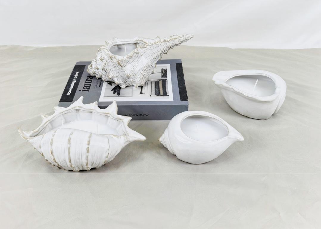 Pemegang lilin datang dalam pelbagai bentuk. Pernahkah anda melihat satu berbentuk seperti kerang?